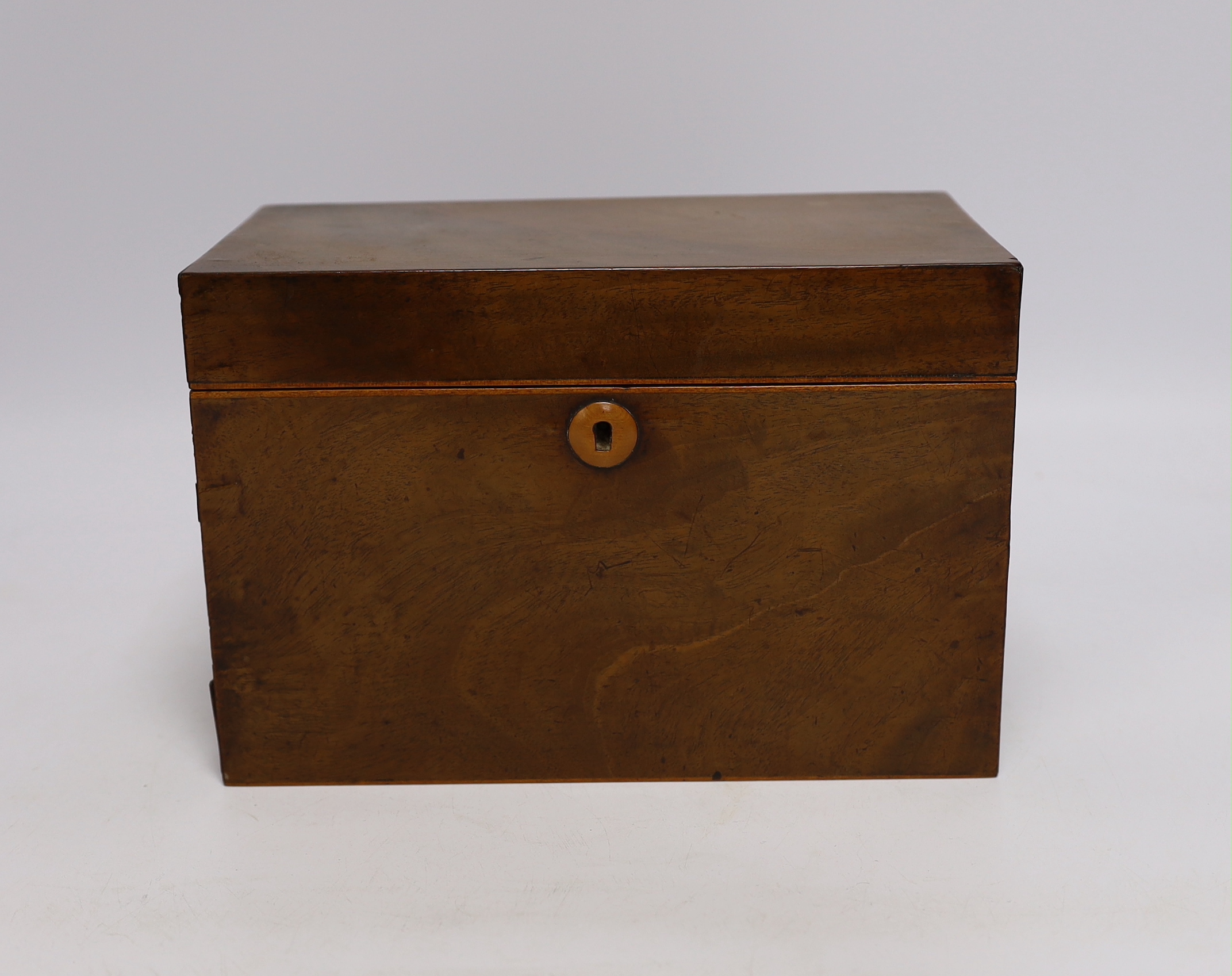 A small 19th century mahogany and fruitwood tea caddy, bone handles to interior, 23cm wide